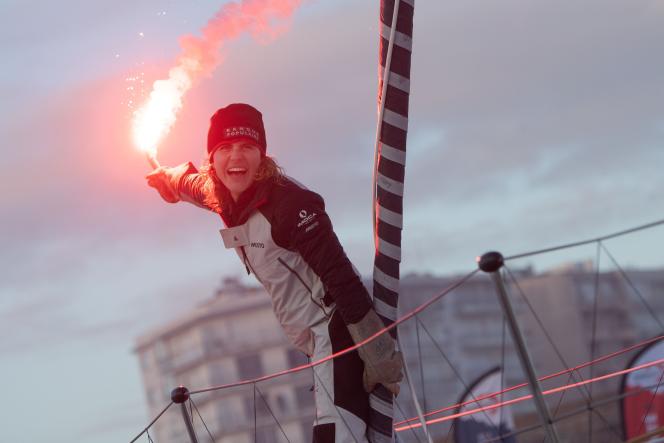 French skipper Clarisse Crémer celebrates her arrival in Les Sables-d'Olonne, after crossing the Vendée Globe line aboard her monohull Imoca 60 