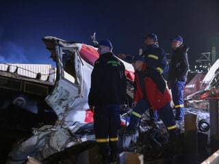 Four rescue workers at the scene of the accident.
