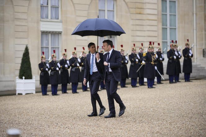 British Prime Minister Rishi Sunak and French President Emmanuel Macron leaving the summit between France and the United Kingdom at the Elysee Palace on March 10, 2023.