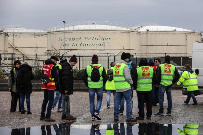 Protesters stand in front of the Gironde Petroleum Warehouse after lifting the blockade in Ambes, western France, on March 8, 2023.