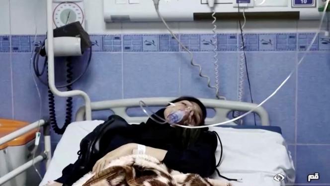 An intoxicated young woman on a hospital bed in an unspecified city in Iran.  Excerpt from a video dated March 2.