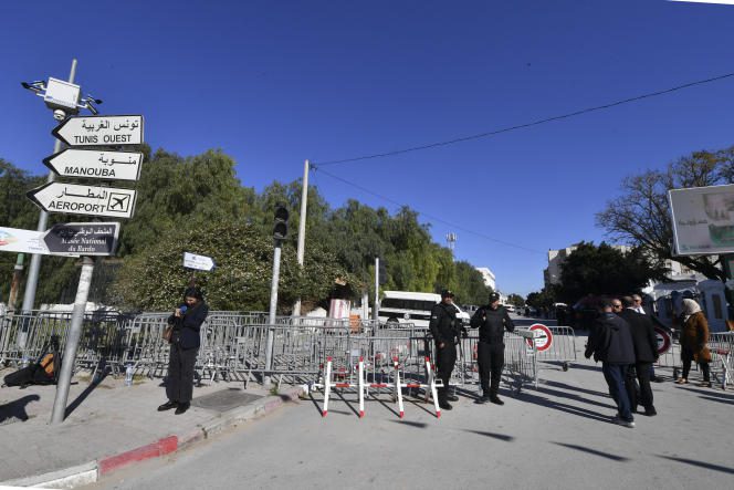 Police officers block access to parliament during the inaugural session of the Assembly of People's Representatives, in Tunis, on March 13, 2023.