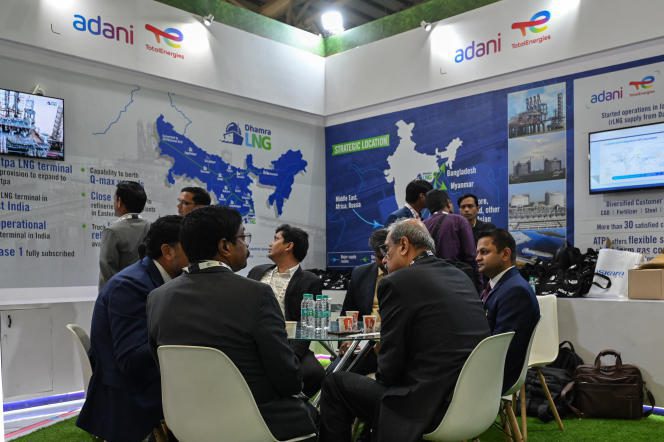 A business discussion at Adani's booth, during an exhibition held as part of India's Energy Week 2023, under India's G20 Presidency, in Bangalore, India, February 7, 2023.