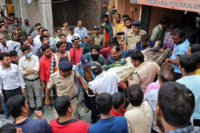 A victim of a temple collapse is evacuated by rescuers in the city of Indore, in the state of Madhya Pradesh, in central India, on March 30.