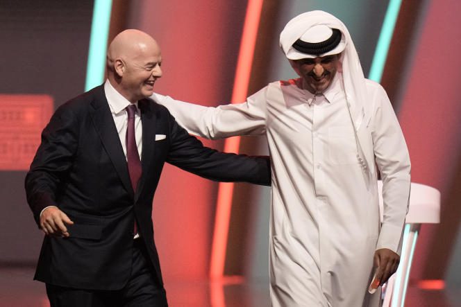 FIFA President Gianni Infantino and Emir of Qatar Sheikh Tamim bin Hamad Al Thani leave the stage ahead of the FIFA World Cup 2022 draw, at the Doha Exhibition and Convention Center , in Qatar, on April 1, 2022. 