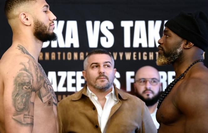 Frenchman Tony Yoka and Franco-Cameroonian Carlos Takam after the official weigh-in, in Paris on March 10, 2023, on the eve of their international heavyweight fight. 