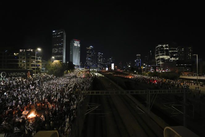 Protesters block a highway in central Tel Aviv, Sunday, March 26, 2023.