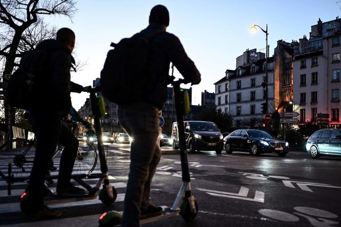 Two people on electric scooters, in Paris, on December 10, 2019. 