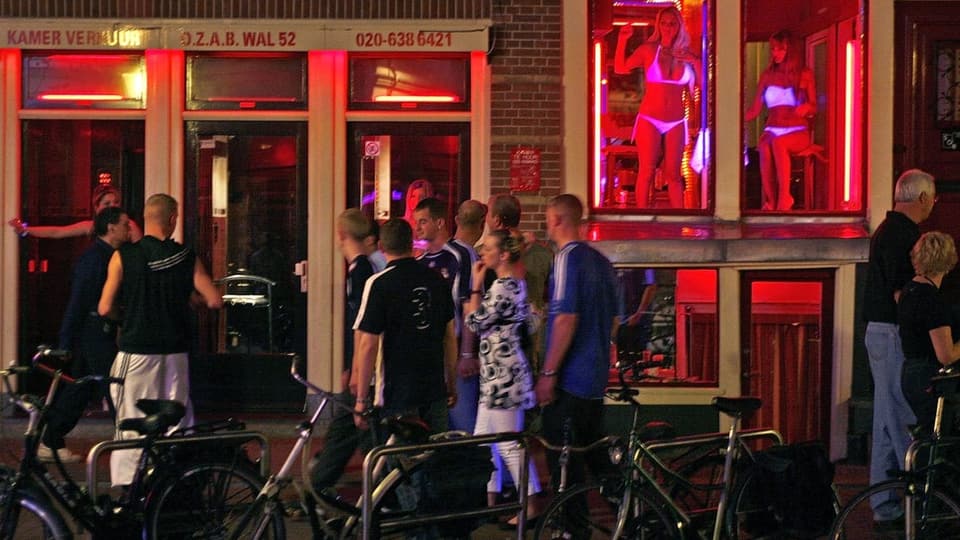 Tourists in the red light district of Amsterdam.