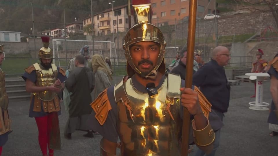 Najendram is disguised as a Roman soldier with a helmet and breastplate.