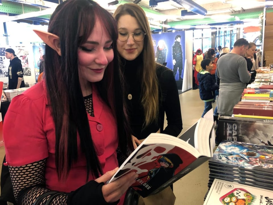 A visitor browses through a manga.