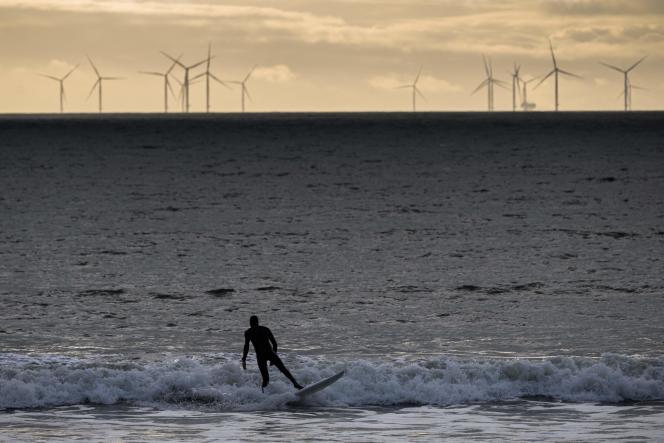 The first offshore wind farm in France, seen from La Baule by a surfer, in January 2022. 