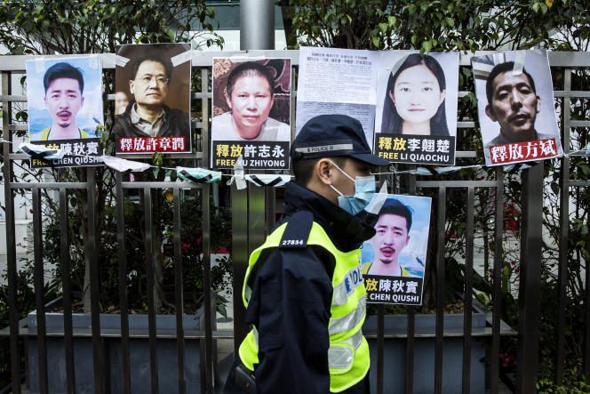 Portraits of human rights activists (including Xu Zhiyong, center), were plastered on a street in Hong Kong during a demonstration in support of the lawyer in February 2020.