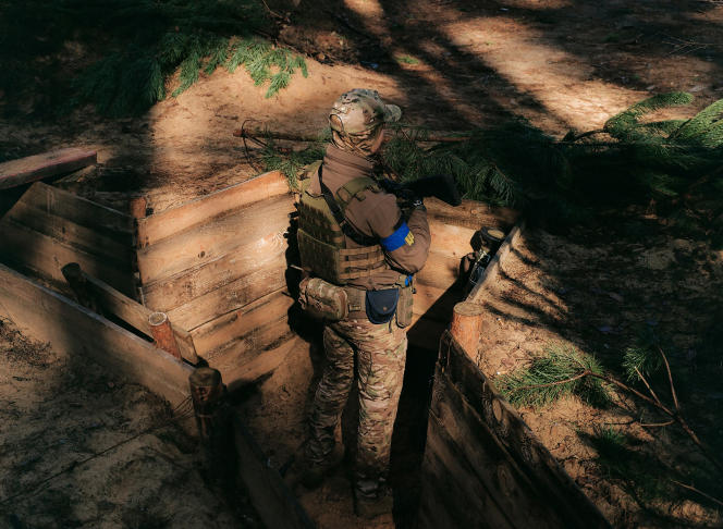 A Ukrainian soldier in a trench on the Belarusian border, Ukraine, April 14, 2023.