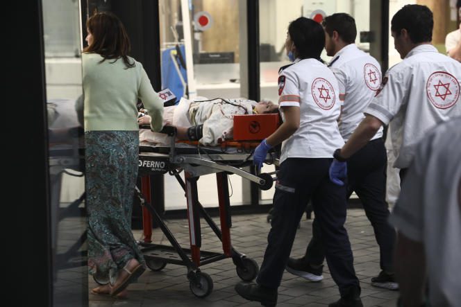 An injured person is taken to hospital in Tel Aviv on April 7, 2023.