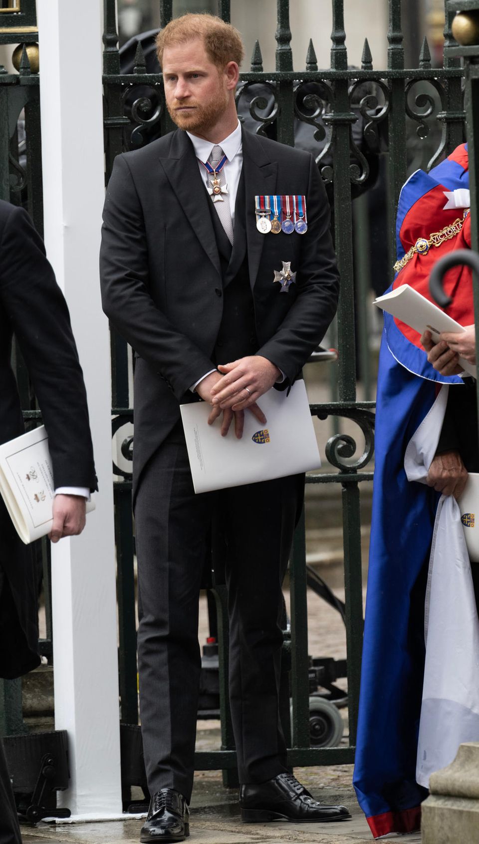 Prince Harry took the coronation program with him.