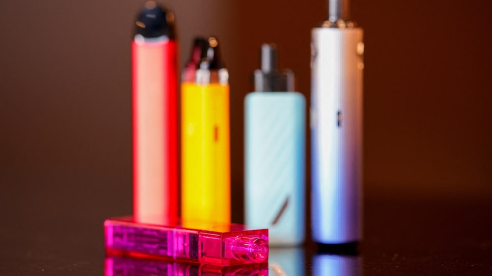 A row of colorful vapes on a counter in Australia.