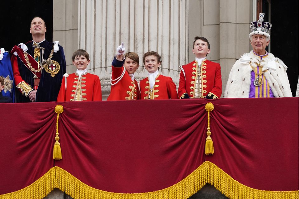 Prince George and Nicholas Barclay (centre) hit it off during King Charles' coronation, always standing side by side.