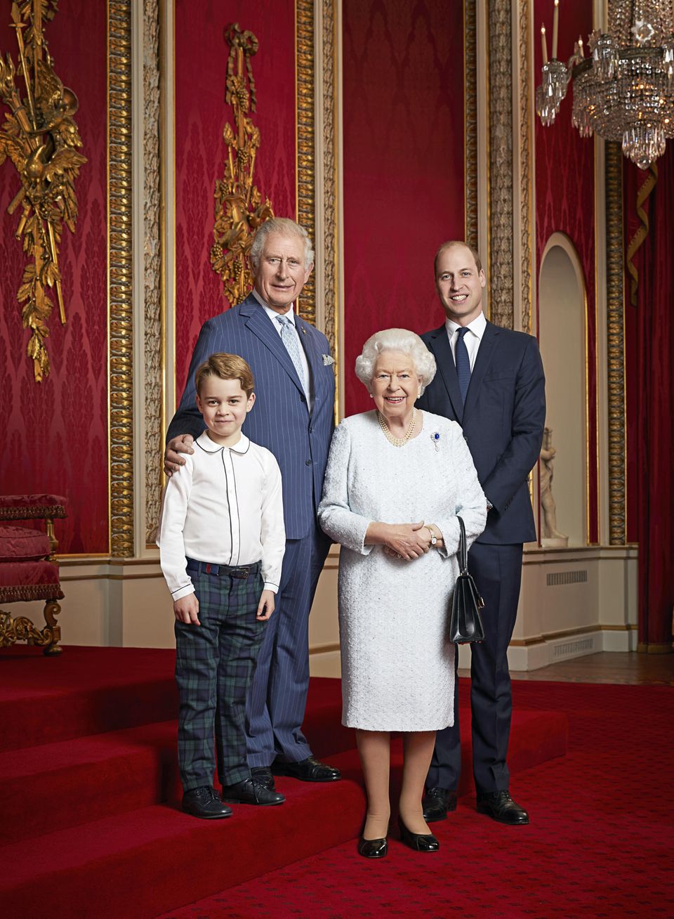 In 2020, Queen Elizabeth (†) posed with Prince George, King Charles (then Prince Charles) and Prince William in the Throne Room of Buckingham Palace.