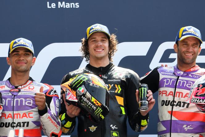Italian Marco Bezzecchi, winner of the French Grand Prix at Le Mans, between Spaniard Jorge Martin (left) and Frenchman Johann Zarco (right), May 14, 2023. 