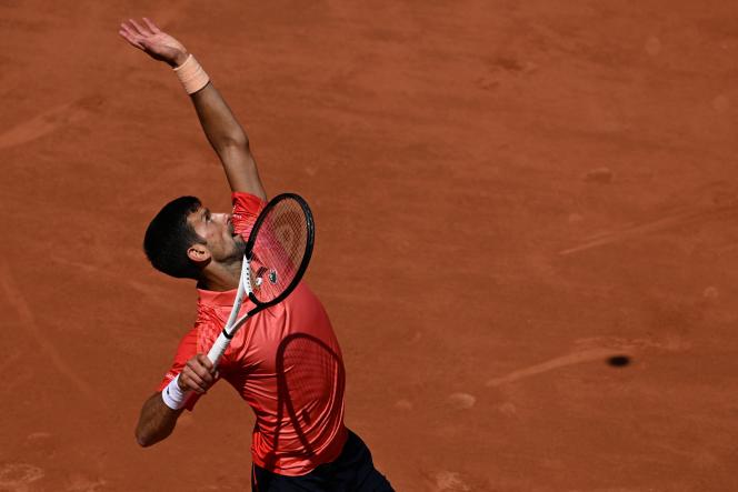 Serbian Novak Djokovic serves American Aleksandar Kovacevic during their men's singles match, on the second day of the Roland-Garros tennis Open, on the Philippe-Chatrier court in Paris, May 29, 2023. 