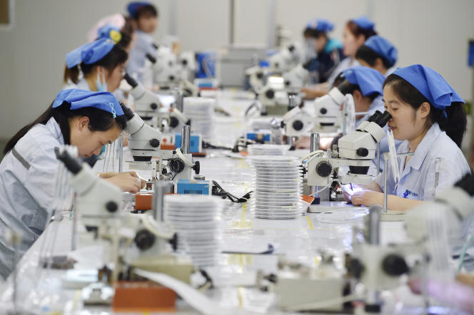 Production of electronic components at a factory in Suqian, Jiangsu Province, China, May 11, 2023.