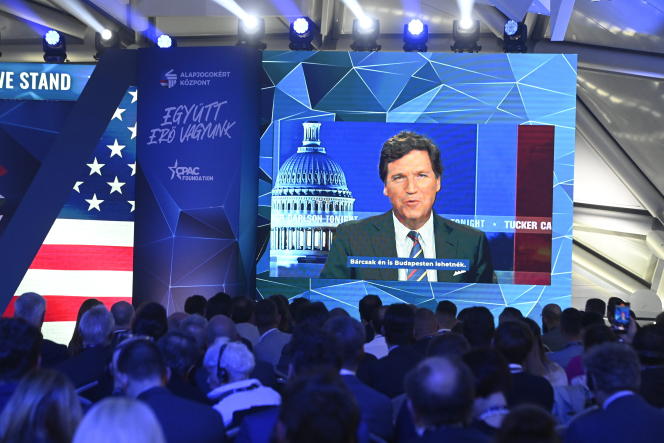 American journalist Tucker Carlson appears on screen during the opening session of the Conservative Political Action Conference of Hungary (CPAC) in Budapest, Hungary, Thursday, May 4, 2023.