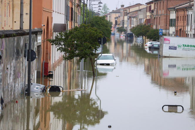 Cars are submerged in water after heavy rains hit Emilia-Romagna, in Lugo, Friday, May 19, 2023.