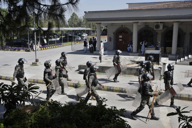 Pakistani paramilitary troops outside a court where former Pakistani Prime Minister Imran Khan is appearing, in Islamabad, Pakistan, Tuesday, May 9, 2023.
