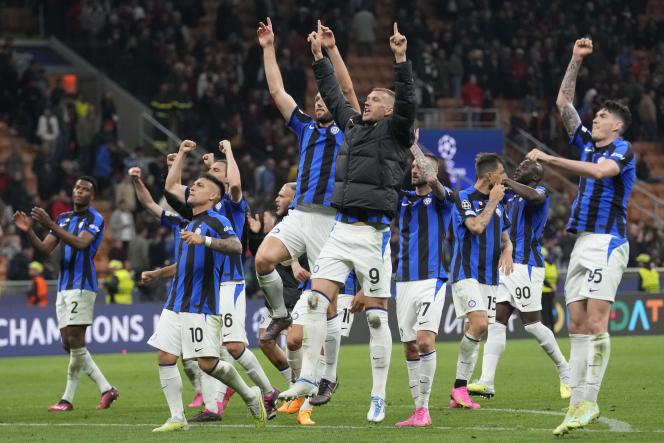 Edin Dzeko, in the center, celebrates with his teammates the victory of Inter over AC Milan, in the semi-final first leg of the Champions League, at the San Siro stadium, Wednesday May 10, 2023. 