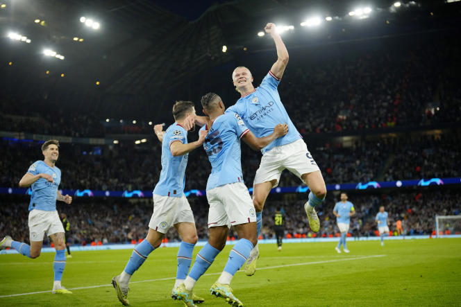 Manchester City players celebrate their qualification for the Champions League final in Manchester after their victory (4-0) against Real Madrid on May 17, 2023.