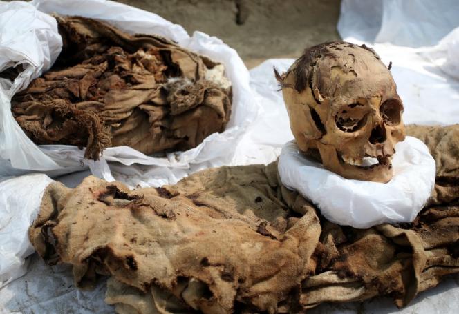 The skull and clothing of a mummy about a thousand years old found in the archaeological site of Cajamarquilla, near Lima (Peru), on April 26, 2023. 