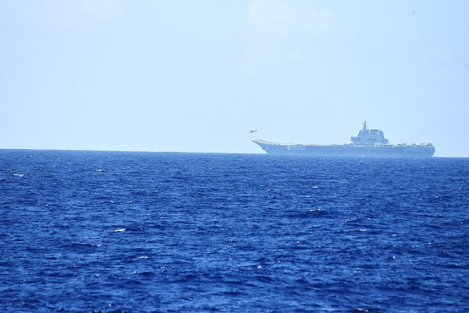 A helicopter takes off from the Chinese aircraft carrier 'Shandong' over the waters of the Pacific Ocean, south of Okinawa prefecture, Japan, in this photo taken on April 15, 2023.