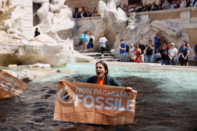 An environmental activist in the Trevi Fountain, Sunday May 21, in Rome.