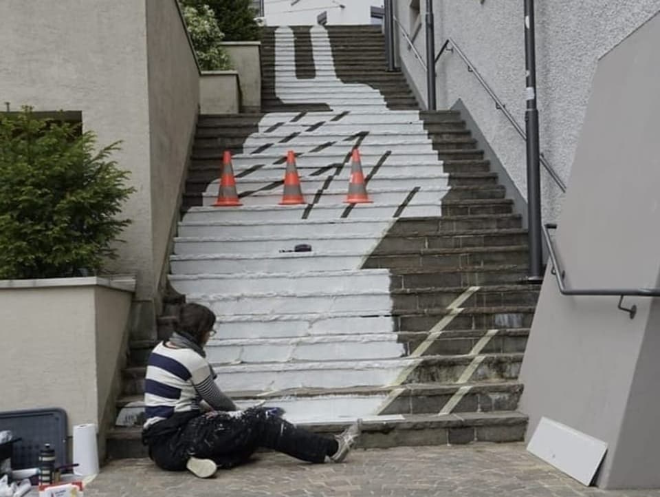 Artist paints stairs