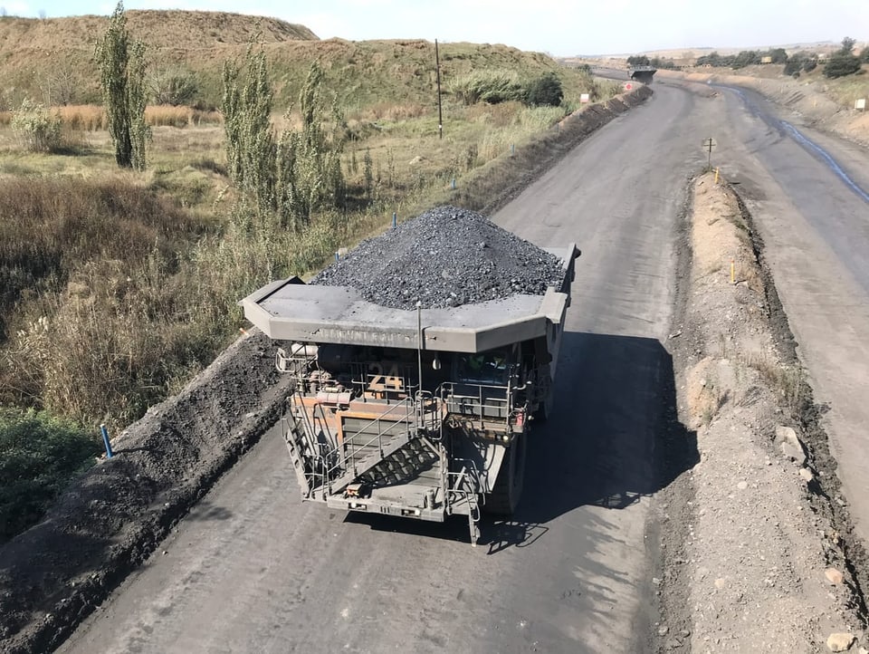 Shot of a loaded coal transport from above.