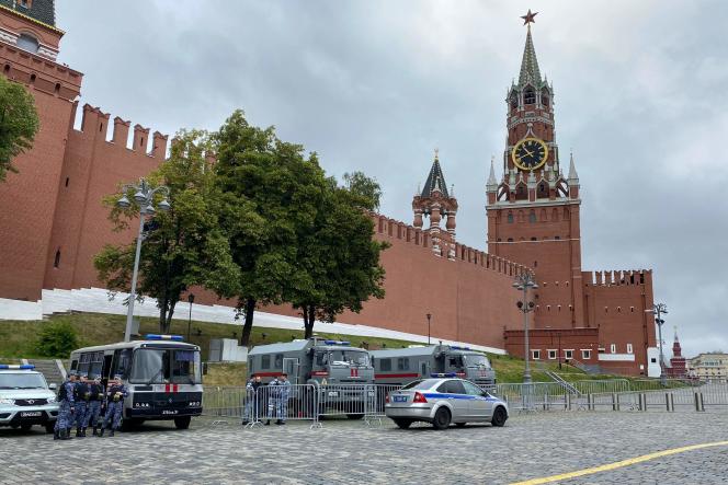 Law enforcement officers patrol outside the main tower of the Moscow Kremlin which overlooks Red Square on June 24, 2023.