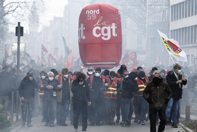 CGT procession in smoke bombs, during a demonstration against pension reform, in Lille, France, on March 23, 2023.