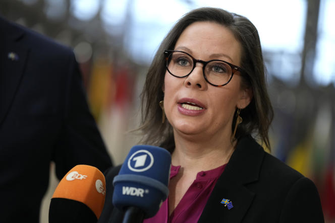 Sweden's Minister for Migration, Maria Malmer Stenergard, speaks to the media on her arrival at the meeting of EU interior ministers at the European Council in Brussels, Thursday March 9, 2023.
