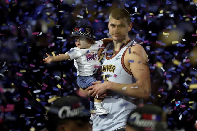 Denver Nuggets' Nikola Jokic celebrates with his daughter after winning (94-89) against the Miami Heat in Game 5 of the NBA Finals, at the Ball Arena in Denver, Colorado on June 12, 2023.