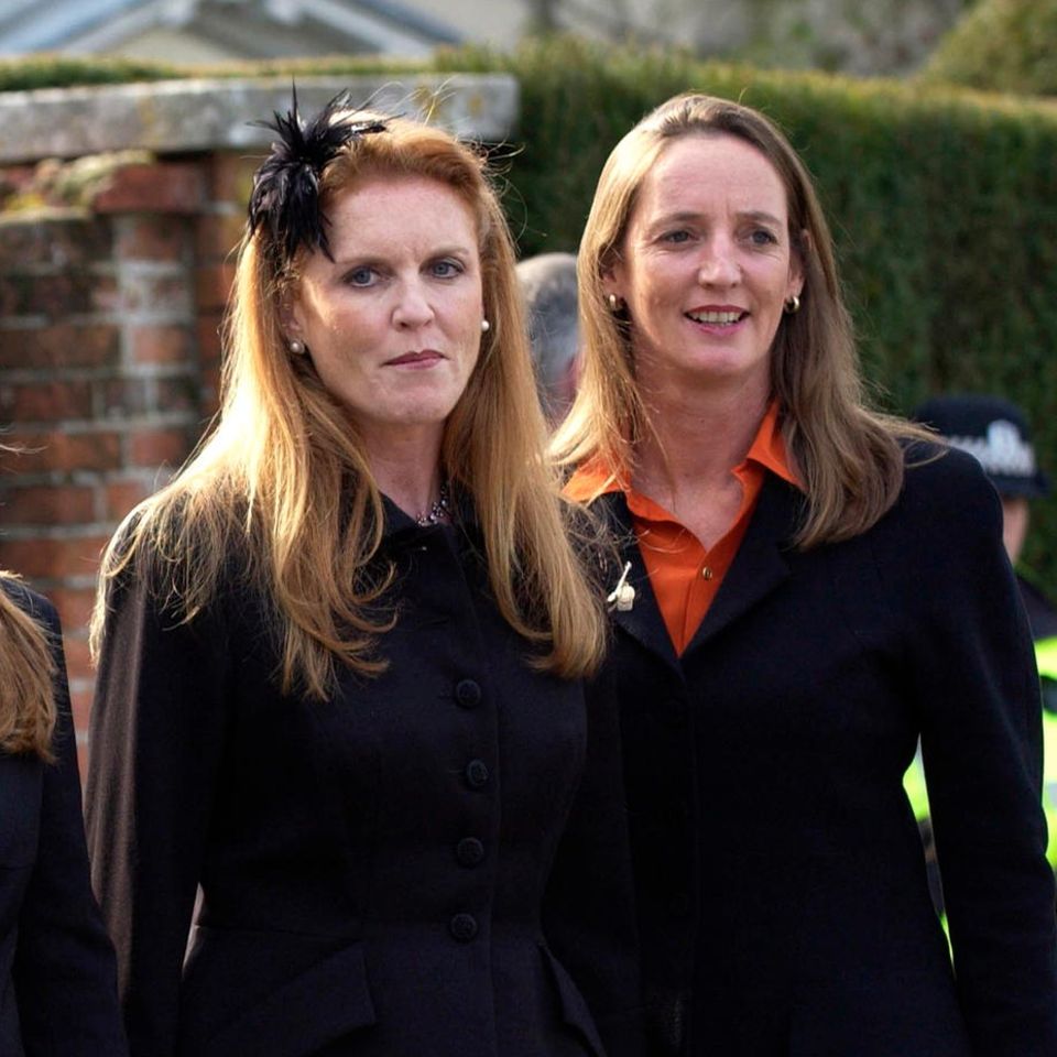 Prince Andrew, Princess Beatrice, Sarah and Jane Ferguson at the funeral of their father Ronald Ferguson on March 24, 2003 in England.