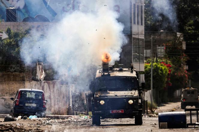 An Israeli tank fires in the city of Jenin in the occupied West Bank on July 4, 2023.