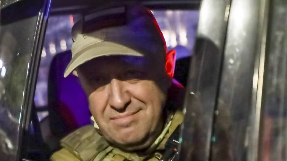 Wagner boss Yevgeny Prigozhin looks out of a military vehicle on a street in Rostov-on-Don.