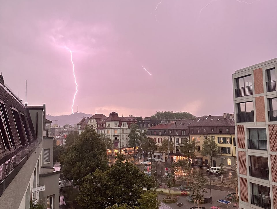 Lightning in the sky during twilight over Bern