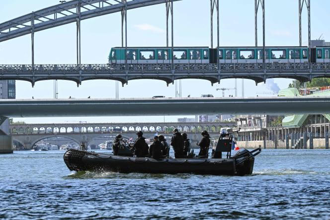 French police officers operate a Zodiac on the Seine in Paris, on July 17, 2023, to test the 