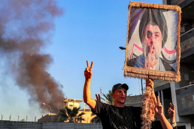 Iraqi demonstrators outside the burnt Swedish embassy in Baghdad, Iraq.  July 20, 2023. 