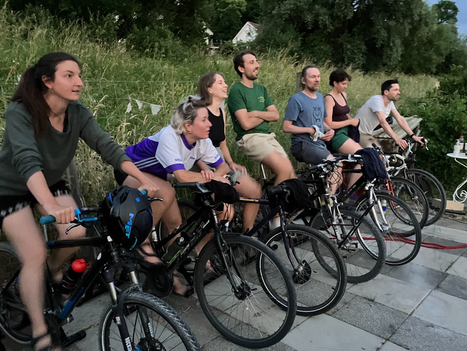 Seven moviegoers on bicycles