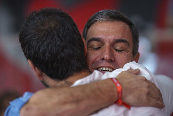 Socialist Party leader and current Prime Minister Pedro Sanchez hugs a party member during an executive committee meeting in Madrid, Spain, Monday, July 24, 2023.