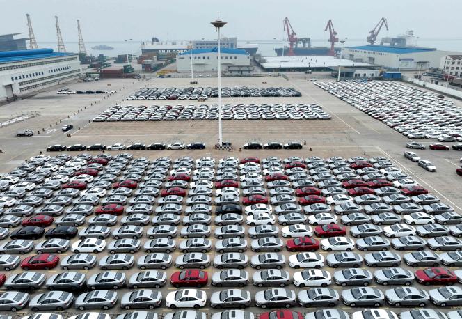 Cars wait to be loaded onto a ship at the port of Lianyungang, east China's Jiangsu Province, July 12, 2023.