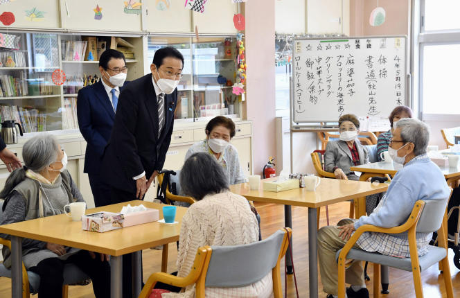 Japanese Prime Minister Fumio Kishida visits a retirement home in Tokyo on May 19, 2022.